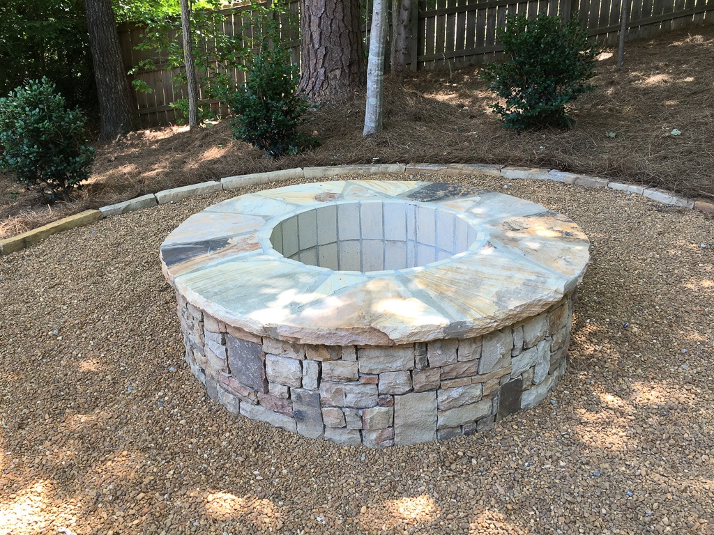 Fire pit in gravel seating area firepits versus fireplaces