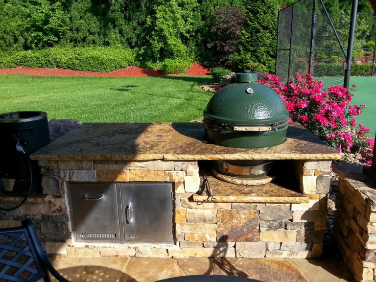 Residential landscaping. Grill and outdoor kitchen prep area for small outdoor kitchen