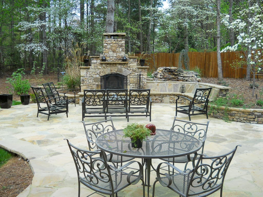 Large patio with seating and outdoor fireplace