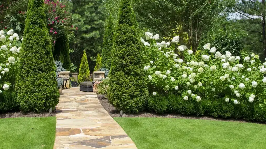 Atlanta Landscaping. Canton Landscaping Flagstone path leading to a patio with lush greenery