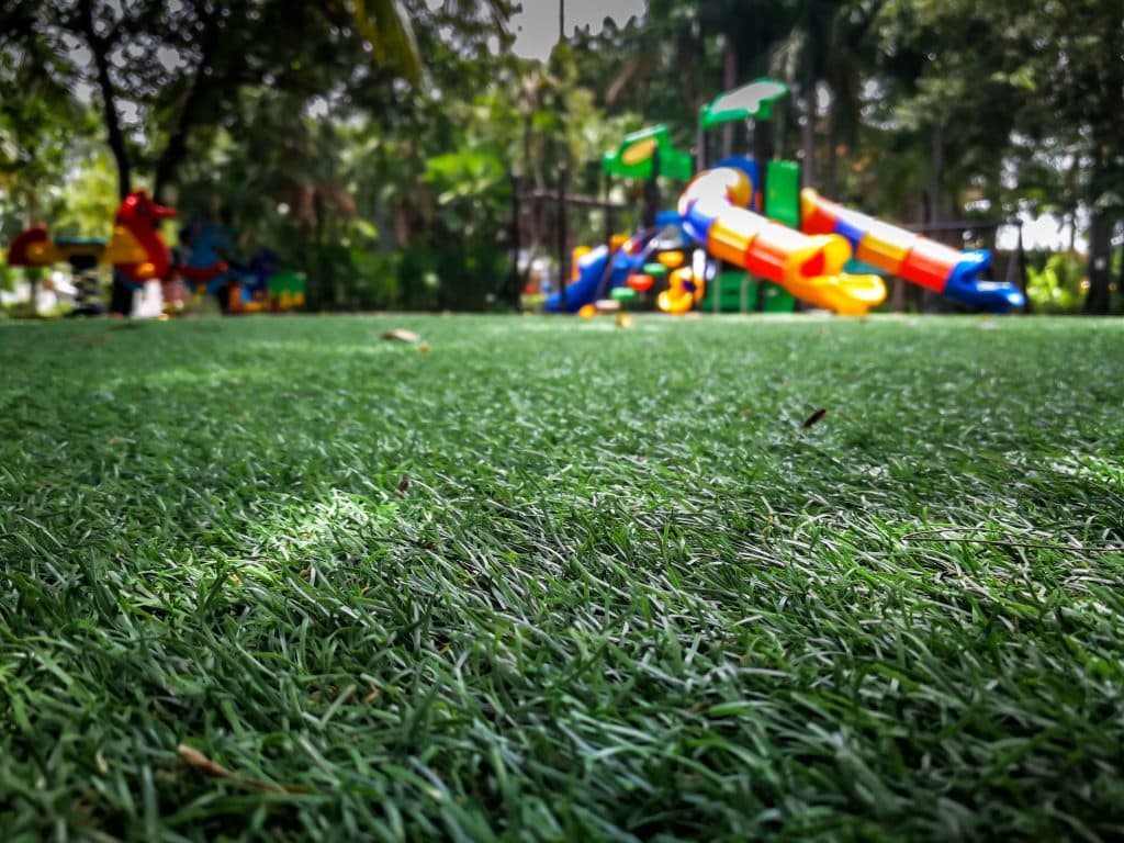 Close-up of green artificial turf in a play area