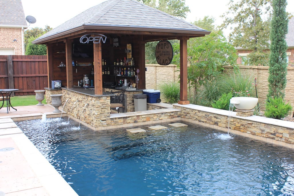 Gazebo with bar setup by pool