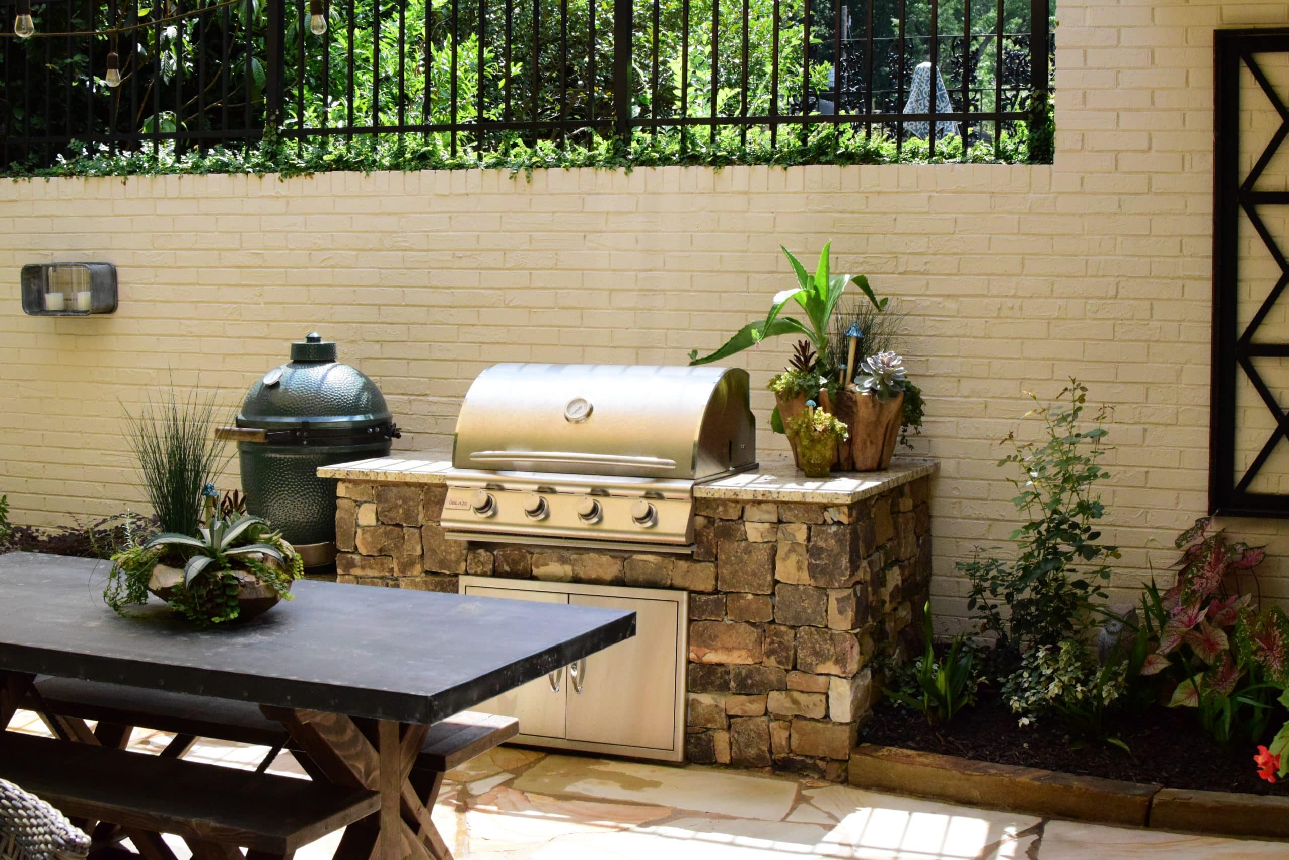 Stylish outdoor grill station with stone cabinetry