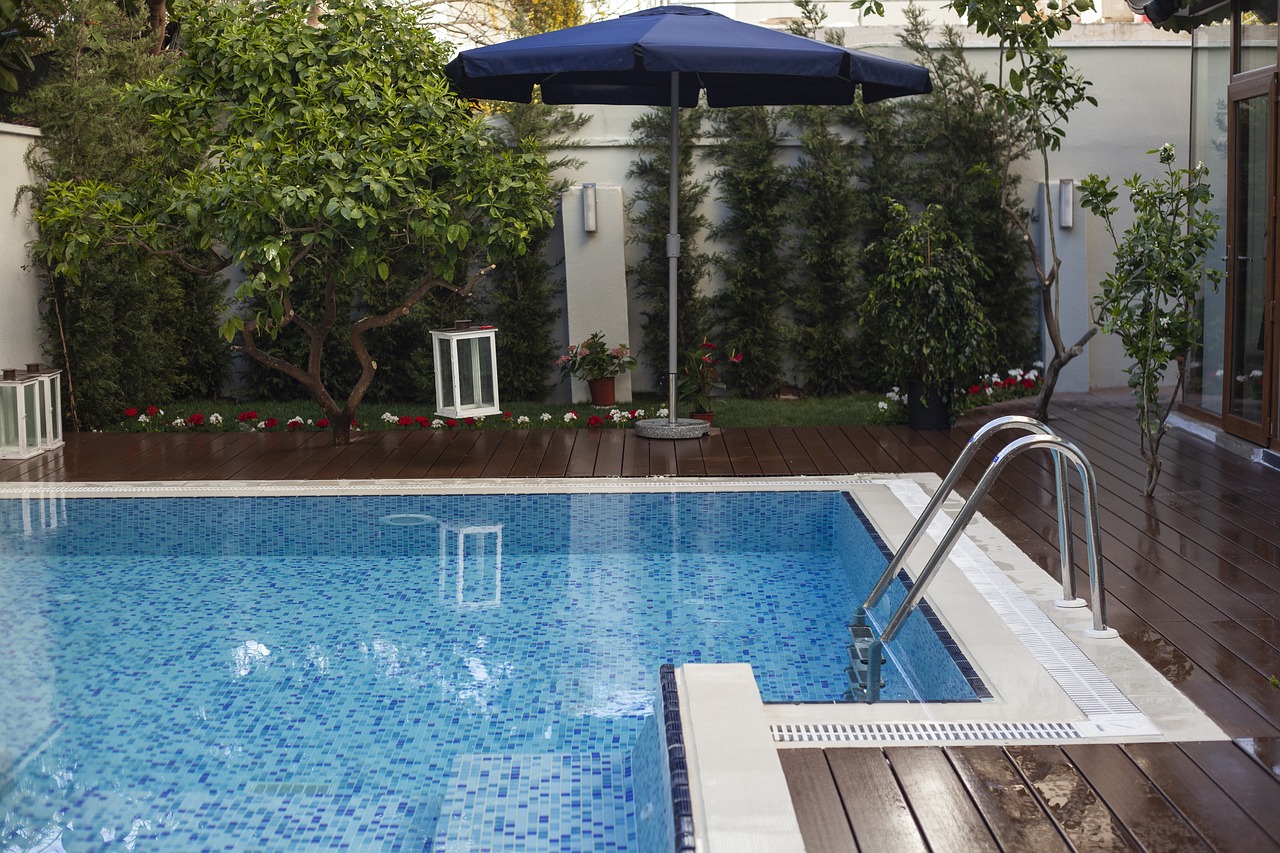 Pool landscape plants and umbrella